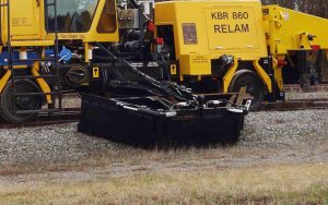 KBR 860 wing attachment doing final profiling on stone track.