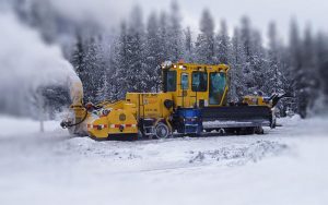 KSF 940 Snow Fighter blowing snow off railway track in a snowy forest.